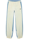 P Bright Wrinkled Nylon Denim Track Pants Blue White - DIESEL - BALAAN 1