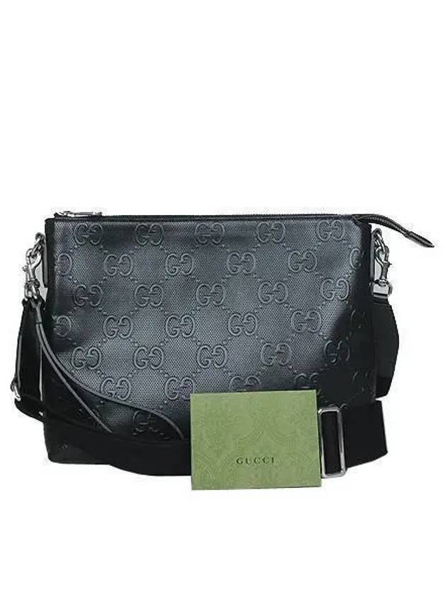 696009 Black leather embossed medium messenger and clutch bag - GUCCI - BALAAN 1