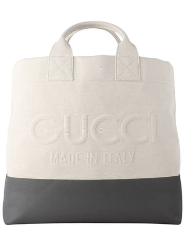 779510 Emboss detail natural canvas luggage shopper bag 33947Y - GUCCI - BALAAN 1