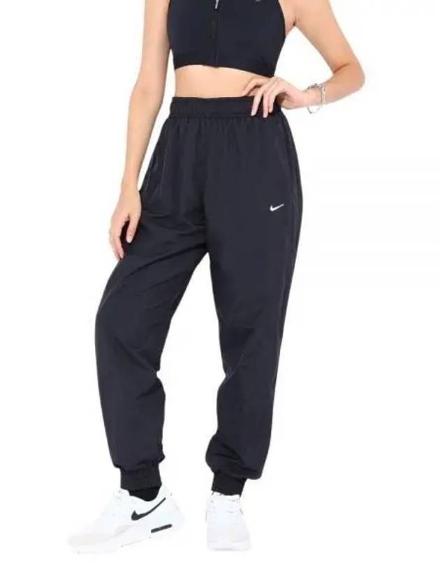 Sportswear Classic Woven Uv Mid-Rise Loose Jogger Track Pants Black - NIKE - BALAAN 1