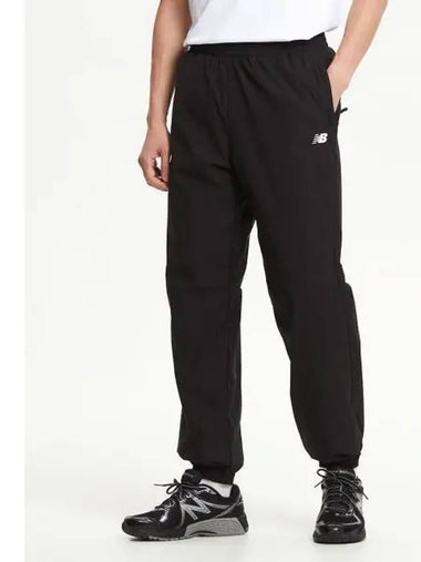 NBNTE42923 UNI Flying Light Warm up Pants BLACK - NEW BALANCE - BALAAN 1