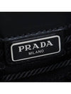 Saffiano Metal Triangle Logo Clutch Bag Black - PRADA - BALAAN.