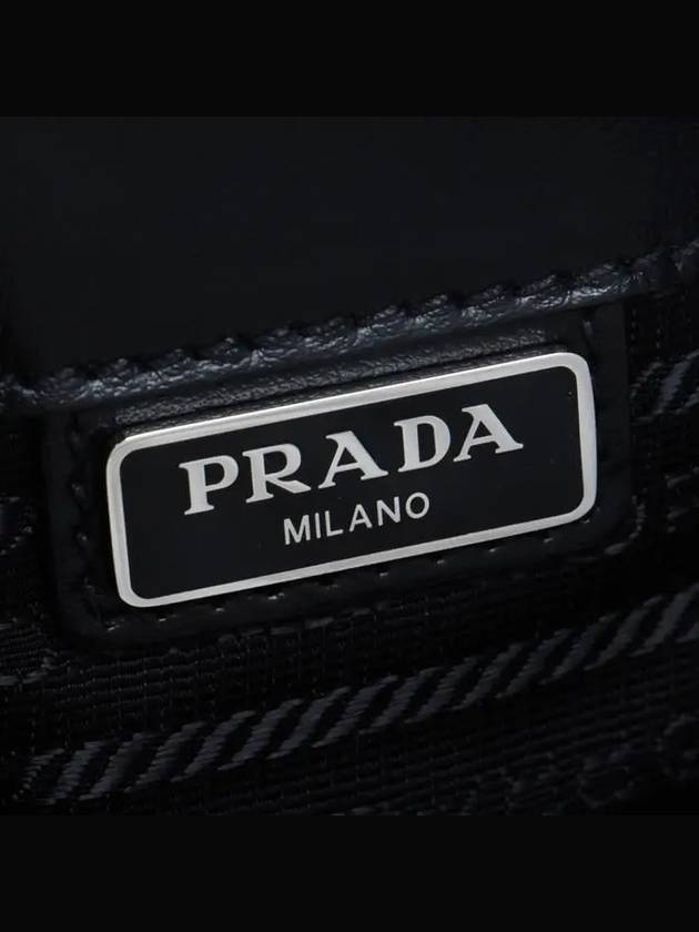 Saffiano Metal Triangle Logo Clutch Bag Black - PRADA - BALAAN.