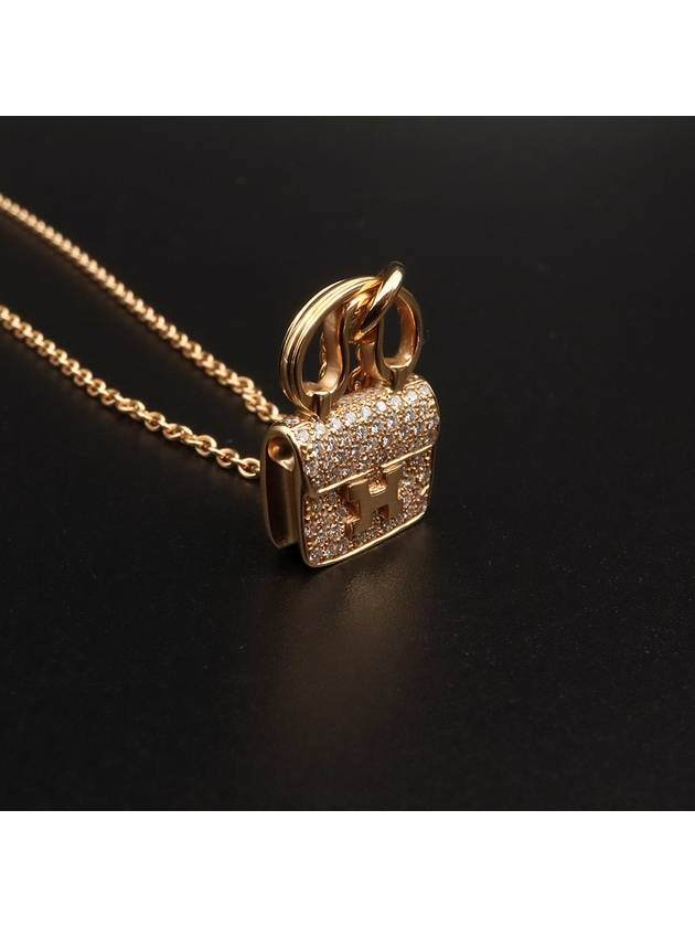 18K 750 yellow gold 0 29CT diamond Constance amulet pendant necklace H109615 - HERMES - BALAAN 4