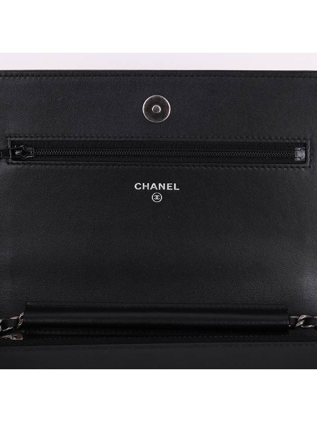 Black calfskin logo WOC cross bag - CHANEL - BALAAN 6