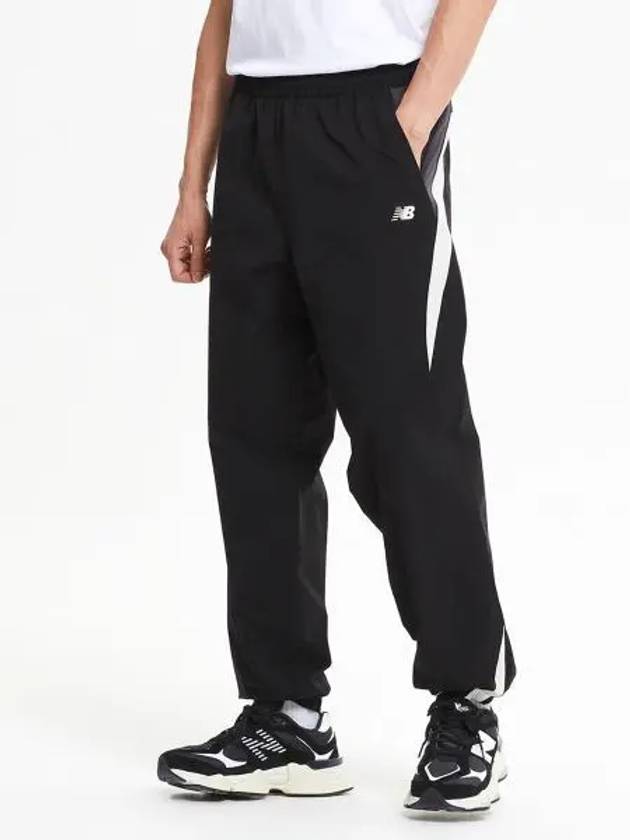 NBNTE32813 UNI N Color Block Warm up Pants BLACK - NEW BALANCE - BALAAN 1