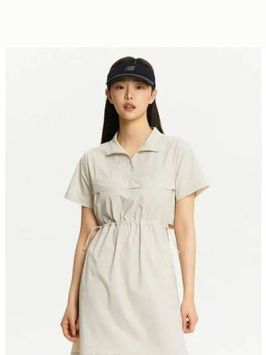 NBNKE3W612 WOMEN Frozen Woven Stretch Collar Short Sleeve Dress BEIGE - NEW BALANCE - BALAAN 1