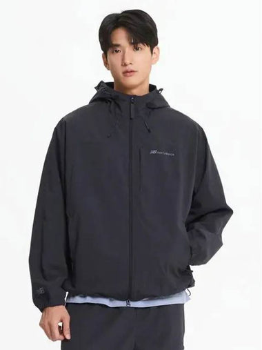 NBNAE31803 UNI ESS 2 LAYER Warm up Jacket CHARCOAL - NEW BALANCE - BALAAN 1