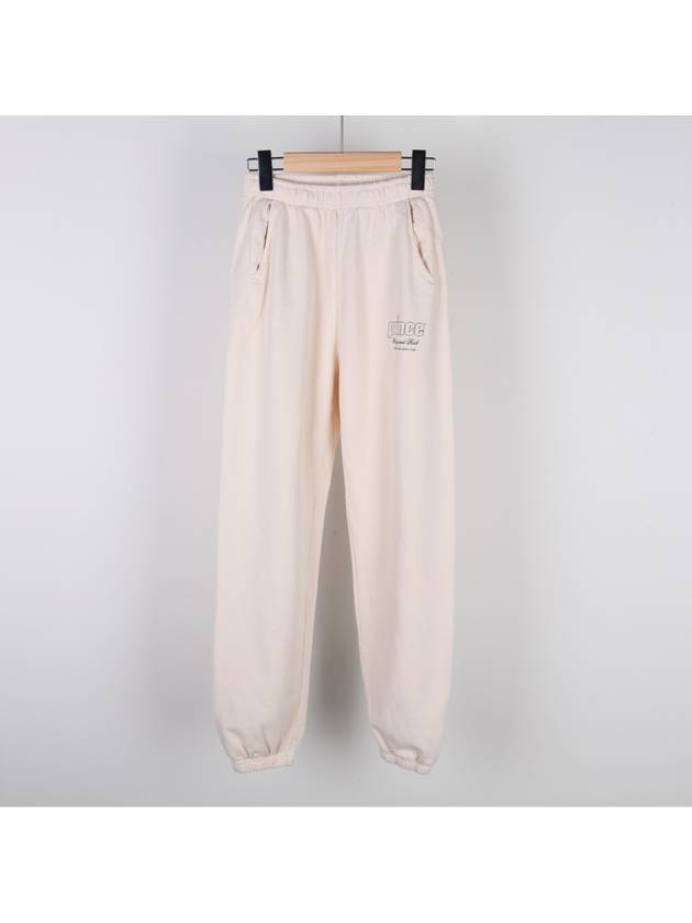 Prince Logo Health Track Pants Cream - SPORTY & RICH - BALAAN.