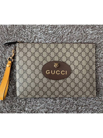 GG Supreme Jaguar gold clutch bag - GUCCI - BALAAN 1