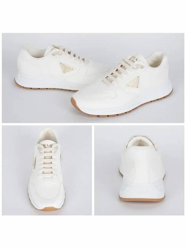 Triangle Logo Nappa Leather Low Top Sneakers Black Ivory - PRADA - BALAAN 3