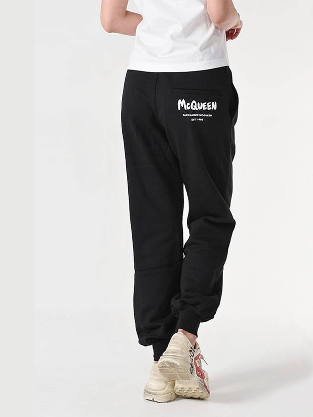 Women's White Graffiti Logo Jogger Pants Black - ALEXANDER MCQUEEN - BALAAN 2