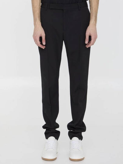 24 ss SUSTAINABLE VIRGIN WOOL PANTS WITH FRONTAL PINCES 607843Y512W1000 B0651012466 - SAINT LAURENT - BALAAN 2