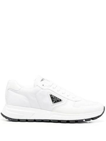 side logo-plaque low-top sneakers - PRADA - BALAAN 1