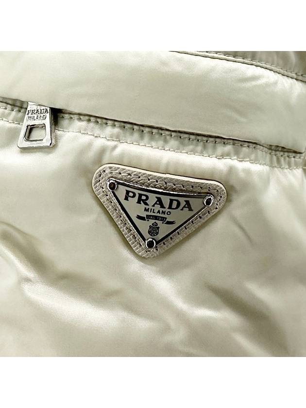 Triangular logo re nylon short padded jumper - PRADA - BALAAN 7