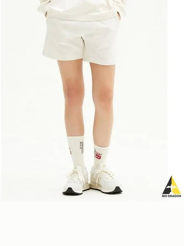 NBNVE2W002 WOMEN Essential 4 part single mesh short pants CREAM - NEW BALANCE - BALAAN 1