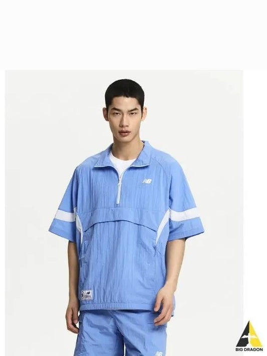 NBNAE22513 UNI NBSC Short Sleeve Anorak LBLUE - NEW BALANCE - BALAAN 1