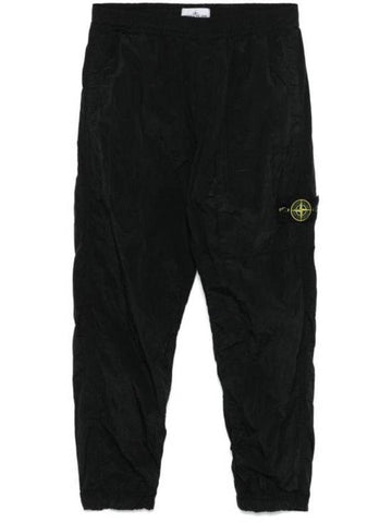 31019 Nylon Metal Econyl Track Pants Black - STONE ISLAND - BALAAN 1