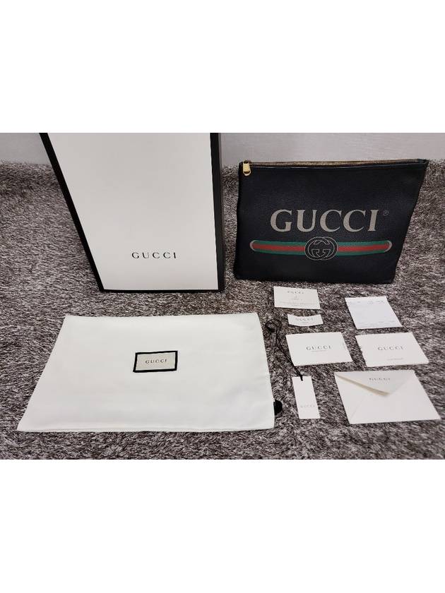 Belted logo print clutch bag - GUCCI - BALAAN 2