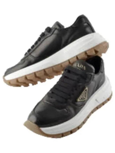 Triangular logo leather sneakers - PRADA - BALAAN 1