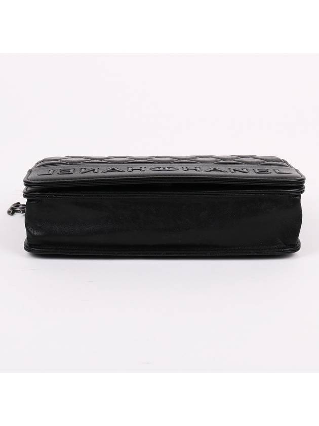 Black calfskin logo WOC cross bag - CHANEL - BALAAN 7