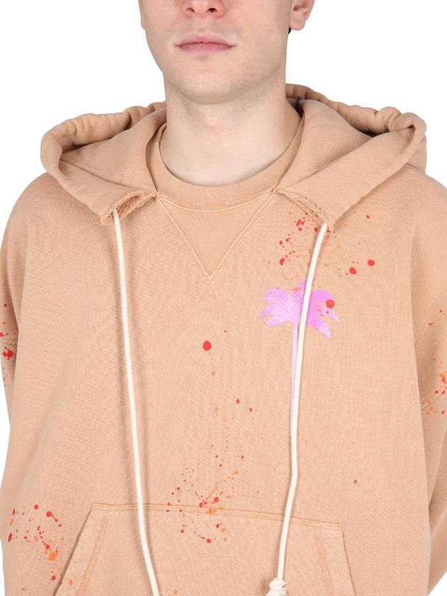 Logo Print Paint Splatter Cotton Hoodie Beige - PALM ANGELS - BALAAN 5