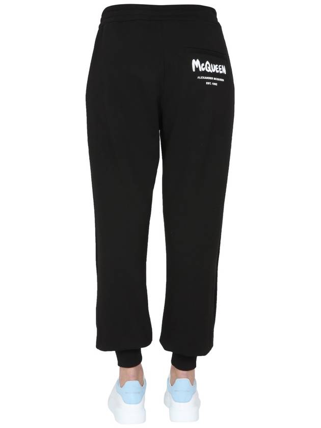 Women's White Graffiti Logo Jogger Pants Black - ALEXANDER MCQUEEN - BALAAN 5