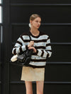 Minnie wearing STRIPE KNIT CARDIGAN BROWN - ANOETIC - BALAAN 6