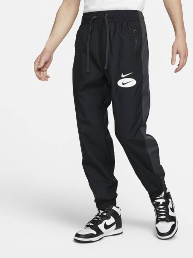 01 DM5492 010 NSW Swoosh League Woven Pants Black - NIKE - BALAAN 1