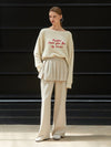 Minnie wearing TWO WAY LAYERED PANTS IVORY - ANOETIC - BALAAN 1