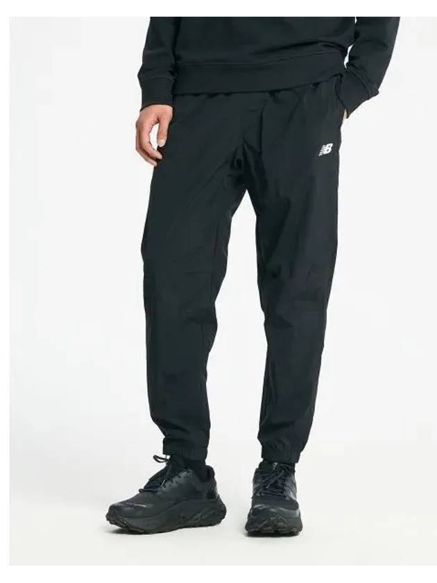 NBNTD4S091 MEN Athletics Remastered Wind Pants BLACK - NEW BALANCE - BALAAN 1