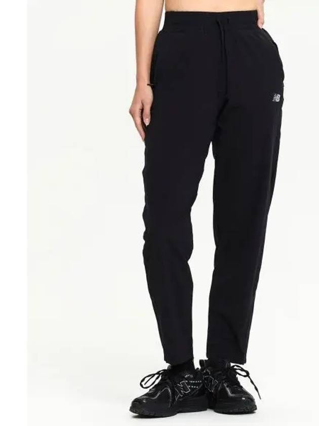 NBNTE4P072 WOMEN Running Woven Pants BLACK - NEW BALANCE - BALAAN 1