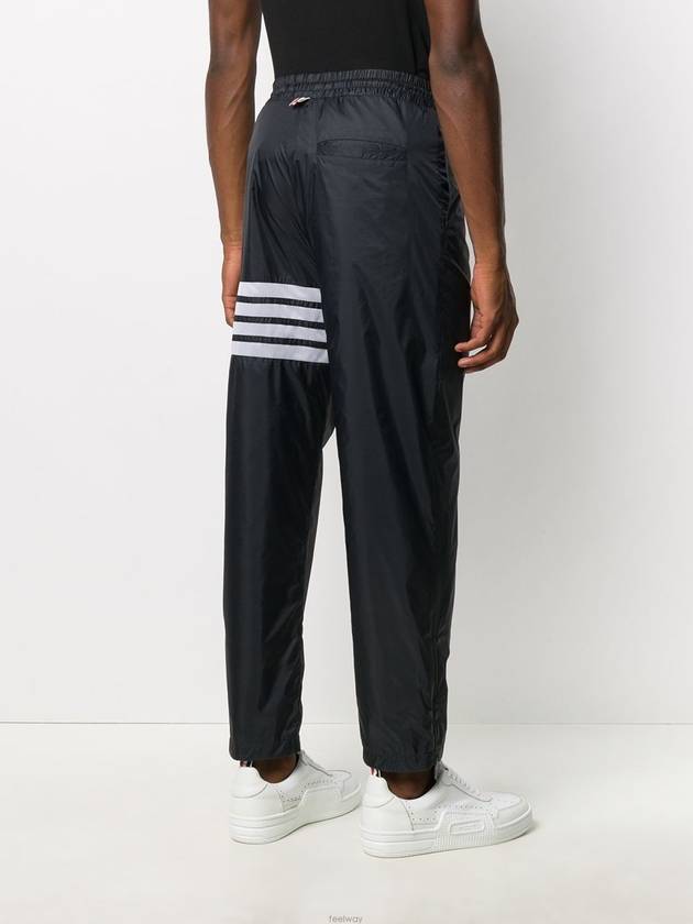 diagonal ripstop track pants navy - THOM BROWNE - BALAAN.