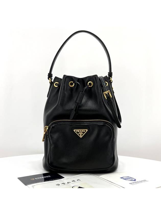 Leather triangle logo bucket bag black - PRADA - BALAAN 1