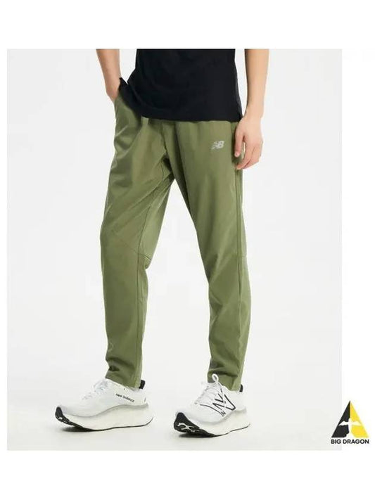 NBNTE2P021 MEN AC Stretch Woven Pants KHAKI - NEW BALANCE - BALAAN 1