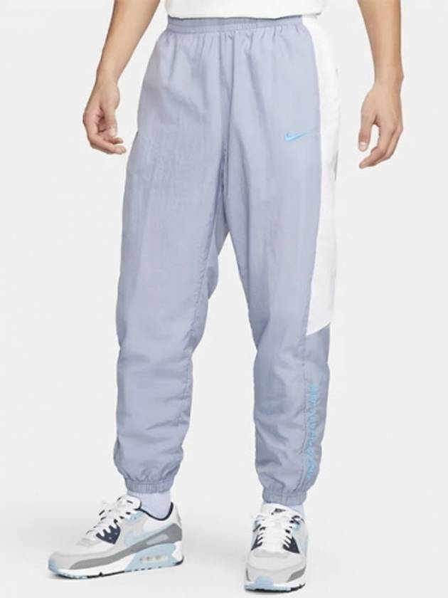 01 FD0949 493 NSW Athletics East Woven Pants Soft Blue White - NIKE - BALAAN 1