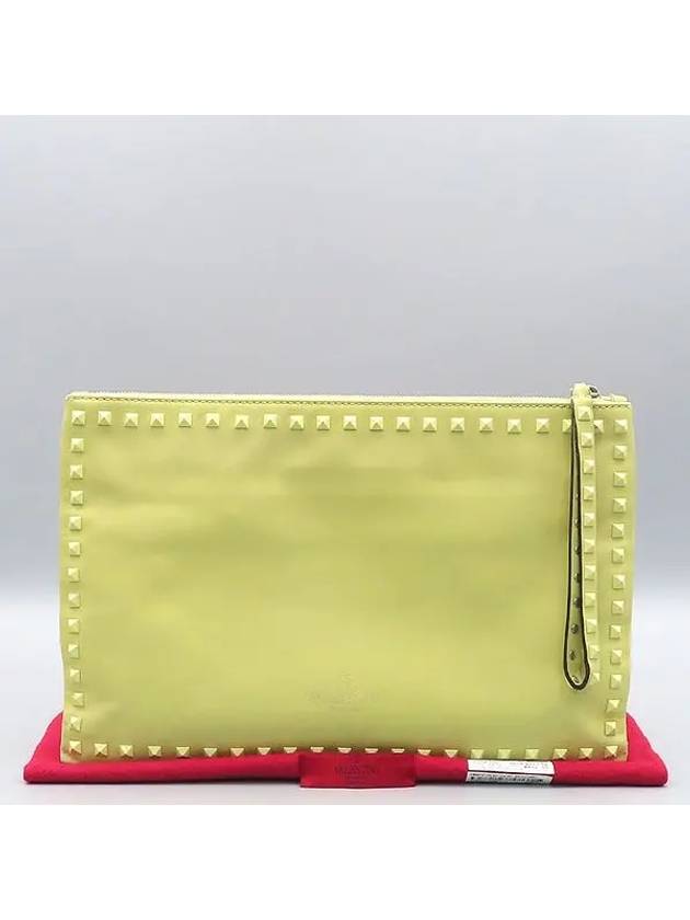 EWB00147 Yellow Garavani Large Rockstud Clutch Bag - VALENTINO - BALAAN 1