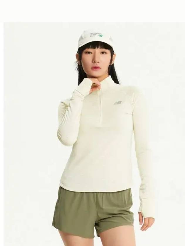 NBNDE4P142 WOMEN Heat Grid Half Zip Up IVORY - NEW BALANCE - BALAAN 1