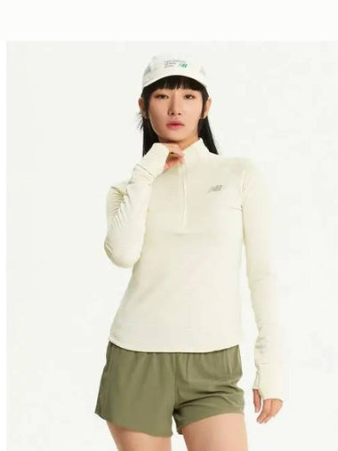 NBNDE4P142 WOMEN Heat Grid Half Zip Up IVORY - NEW BALANCE - BALAAN 1