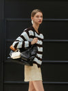 Minnie wearing STRIPE KNIT CARDIGAN BROWN - ANOETIC - BALAAN 5