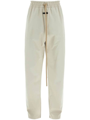 wide leg nylon track pants in cement - FEAR OF GOD - BALAAN 1