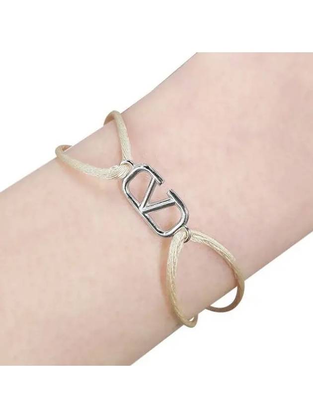 V logo signature knot bracelet arm 37280533 1095191 - VALENTINO - BALAAN 1