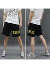 Men's Yellow Logo Printing Sweat Shorts Black - DSQUARED2 - BALAAN 3