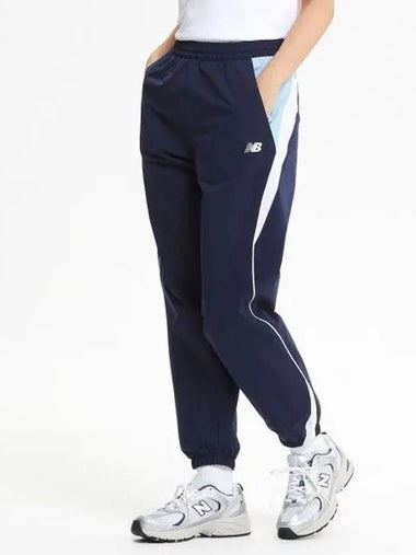 NBNTE32813 UNI N Color Block Warm up Pants NAVY - NEW BALANCE - BALAAN 1