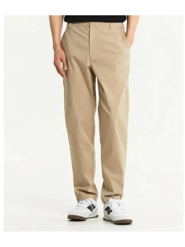 NBNTE4S031 MEN Tapered Pants DBEIGE - NEW BALANCE - BALAAN 1