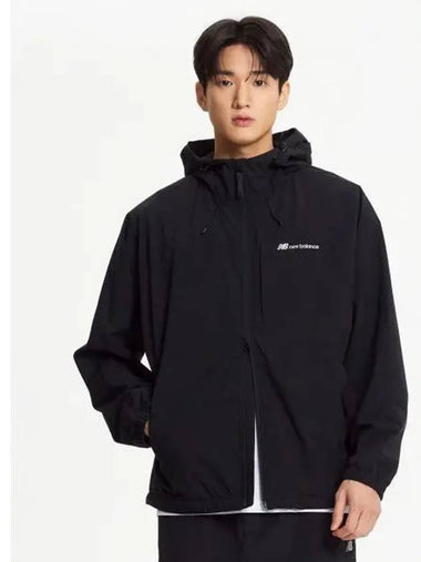 NBNAE31803 UNI ESS 2 LAYER Warm up Jacket BLACK - NEW BALANCE - BALAAN 1