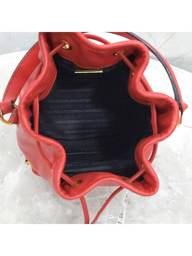 Lux You Red gold triangle logo leather bucket bag - PRADA - BALAAN 6