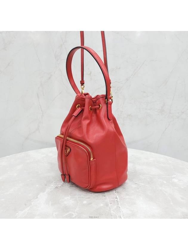 Lux You Red gold triangle logo leather bucket bag - PRADA - BALAAN 2