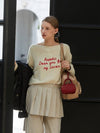 Minnie wearing ANC EMBROIDERY BOATNECK KNIT IVORY - ANOETIC - BALAAN 3