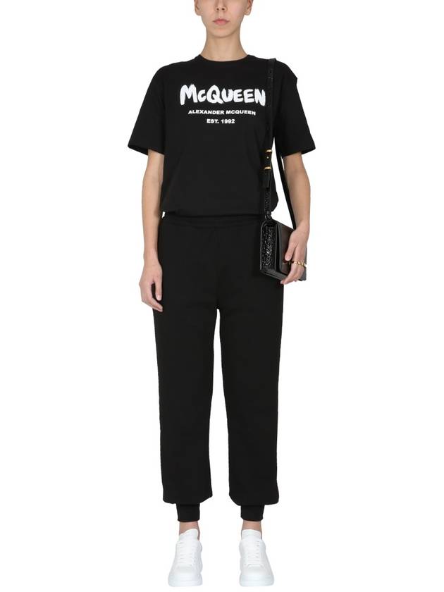 Women's White Graffiti Logo Jogger Pants Black - ALEXANDER MCQUEEN - BALAAN 3